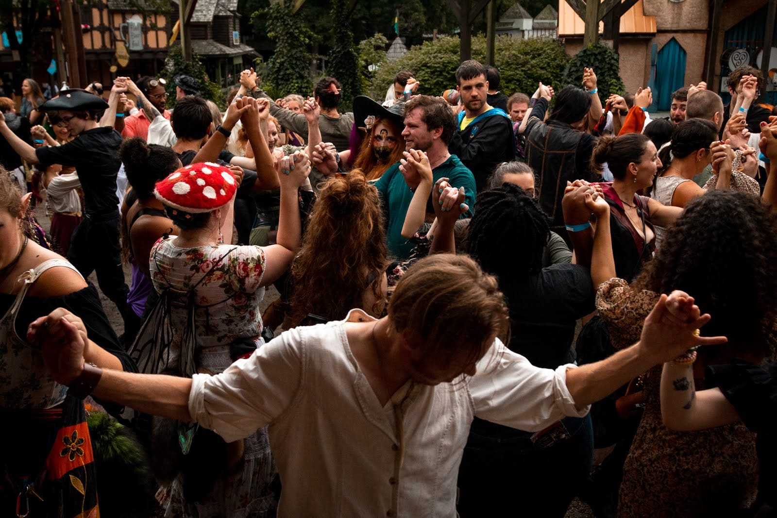 people in costumes dancing at a party