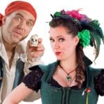 Woman in green costume, pirate holding small skull